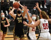  ?? JASON SCHMITT — FOR MEDIANEWS GROUP ?? Madison Heights Bishop Foley junior Melanie Moore (34) scores two of her 10points in the Ventures’ 52-42victory over Rochester Hills Lutheran Northwest Monday night at Bishop Foley High School.