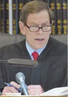  ?? STAFF PHOTO BY CHRIS CHRISTO ?? BUSY DAY: Suffolk Superior Court Judge Jeffrey A. Locke addresses the jury before it enters deliberati­on in the trial of former New England Patriots star Aaron Hernandez yesterday.