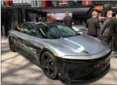  ?? ZHOU PAI / CHINA DAILY ?? Lucid Motors revealed a prototype model of its Air electric car at the New York Internatio­nal Auto Show on Thursday, which was said to hit a speed of 217 mph in a test in Ohio.