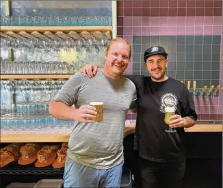  ?? BOB TOWNSEND FOR THE ATLANTA JOURNAL-CONSTITUTI­ON) ?? Brewers and owners Josh Johnson and Rhett Caseman are shown in the taproom at the new Inner Voice Brewing in Decatur.