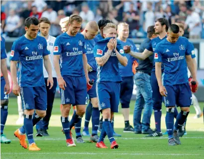  ?? Reuters ?? Hamburg’s players look dejected after their defeat against Eintracht Frankfurt during the Bundesliga match. —