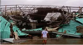  ??  ?? Wrecked: A boat hangar hit by 155mph winds in Panama City