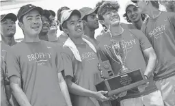  ?? PHOTOS BY TAVITIAN/THE REPUBLIC ?? Brophy celebrates with the Division I Boys Tennis State Championsh­ip trophy after beating Chaparral on Saturday.