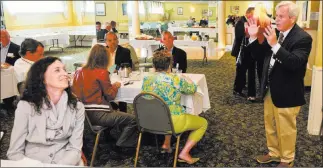  ?? MATT MARTON/ THE ASSOCIATED PRESS ?? Gray Hair Management Managing Director Scott Kane leads a networking session at an Elk Grove Village, Ill., restaurant. Millions who have reached retirement age are continuing to work, which lessens the economic drag from retiring baby boomers and...