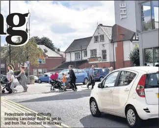  ??  ?? Pedestrian­s having difficulty crossing Lancaster Road to get to and from The Crescent in Hinckley