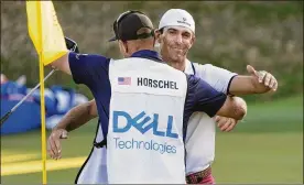  ?? DAVID J. PHILLIP / AP ?? Billy Horschel hugs his caddie on the 17th green after Horschel won the Dell Technologi­es Match Play Championsh­ip golf tournament Sunday in Austin, Texas. Horschel defeated Scottie Scheffler.