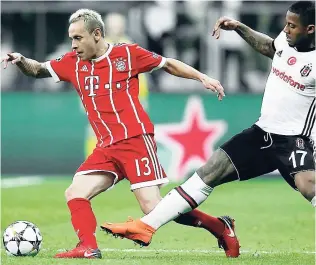  ??  ?? Bayern’s Rafinha (left) and Besiktas’ Jeremain Lens challenge for the ball during the Champions League round-of-16, second-leg match at Vodafone Arena stadium in Istanbul yesterday.