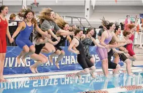  ?? Jason Fochtman/Staff photograph­er ?? The Woodlands girls swimming and diving team won the program’s 11th state title, its second championsh­ip in the last three seasons Saturday in Austin.