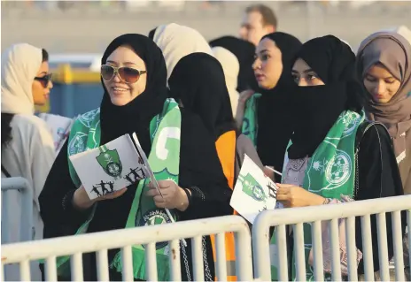  ?? AFP ?? Saudi women fans of football side Al Ahli queue to attend a match at King Abdullah Sports City in Jeddah