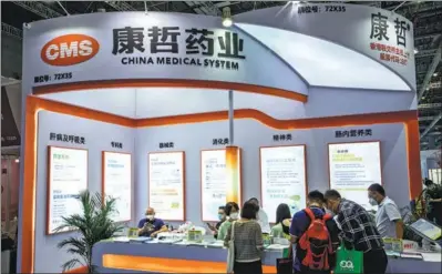  ?? PROVIDED TO CHINA DAILY ?? Visitors gather at the CMS booth during a medical exhibition in Shanghai. The company announced the acquisitio­n of a factory in Singapore in December to expand its global footprint.