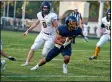  ?? AIMEE BIELOZER — FOR THE MORNING JOURNAL ?? Rocco Conti of Olmsted Falls makes a move to gain yards against North Ridgeville on Sept. 17.