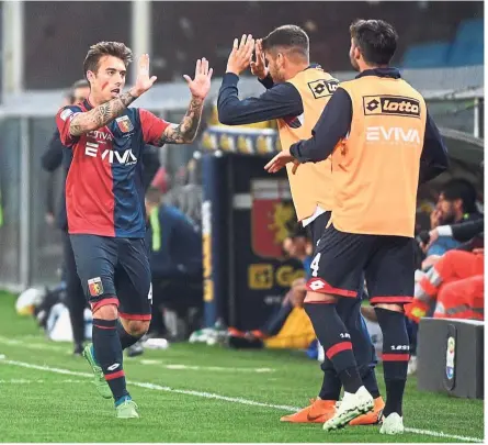  ??  ?? Right on target: Genoa’s Iuri Medeiros (left) celebratin­g with teammates after scoring the first goal against Verona during the Serie A match at the Luigi Ferraris Stadium on Monday. — AP