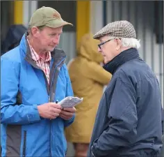  ??  ?? Johnny Kavanagh and Christy Murphy discussing the form at Thursday’s re-opening of Enniscorth­y greyhound track.