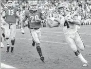  ?? Matthew Hinton Associated Press ?? LSU RUNNING BACK Nick Brossette scores a touchdown against Georgia during the second half.