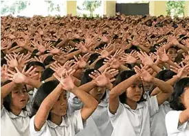  ??  ?? HANDINHAND Students performing their song of gratitude.