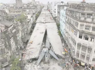  ?? Photo: AP ?? The partially collapsed flyover in Kolkata, India. About 100 metres of the structure fell, whileother sections remain standing.