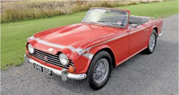  ??  ?? The TR250 got added graphics and other minor tweaks to distinguis­h it from the TR4/TR4A.