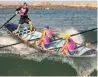  ?? | PETER DE ?? A TEAM of surf rowers riding a wave in the first surf rowing interprovi­ncial tournament in 20 years.
GROOT