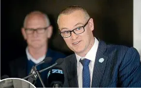  ?? ROSA WOODS/STUFF ?? ‘‘We’ve been asking too much of our nurses for too long,’’ says Health Minister David Clark. Inset: NZNO chief executive Memo Musa signs the accord at Parliament.