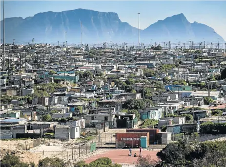  ?? /David Harrison ?? Not home: Squalid conditions in an informal settlement in Khayelitsh­a, a township where the legacy of humiliatio­n from the apartheid era is laid bare daily as people struggle with poverty, broken homes and domestic abuse.