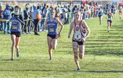  ?? SCOTT ASH / NOW NEWS GROUP ?? Whitefish Bay's Lily Kriegel (224) and Maya Stevic (228) race Shorewood's Annika Elliott (6) to the finish Saturday. Find more photos at