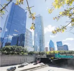  ?? ?? Traffic flows freely in Dallas last summer, and there may be fewer drivers in the future as the U.S. recorded its lowest population growth since 1776.