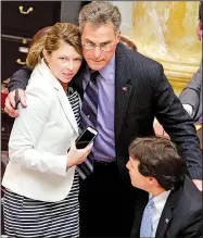  ?? Arkansas Democrat-Gazette/STEPHEN B. THORNTON ?? Rep. Charlie Collins (center) shares congratula­tions Thursday with Rep. Michelle Gray and Rep. Clarke Tucker after the House approved his concealed-carry amendment.