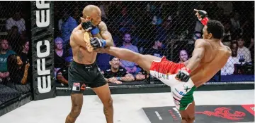  ?? ?? KICKING A . . . Zimbabwean mixed martial artist Sylvester “The Gladiator” Chipfumbu (left) in action against
UP STORM South Africa’s Sandile Manengela during an 110 event
EFC