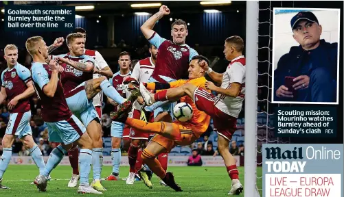  ?? REX ?? Goalmouth scramble: Burnley bundle the ball over the line