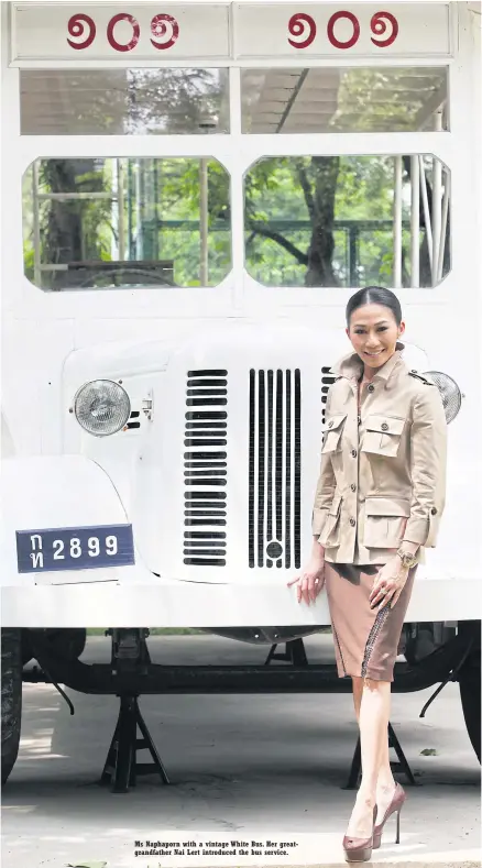  ?? PHOTO: THITI WANNAMONTH­A ?? Ms Naphapor n with a vintage White Bus. Her gr eatgrandfa­ther Nai Lert introduced the bus service.