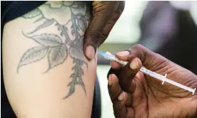  ?? Graham Hughes/AP ?? A man receives a monkeypox vaccine at an outdoor walk-in clinic in Montreal. Photograph: