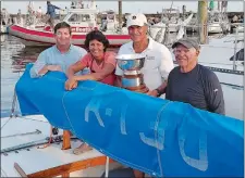  ?? PHOTO COURTESY OF DAVE PECK ?? From left, Bill Healy, Diane Peck Rothman, helmsman Dave Peck and Tom Peck sailed “Miss April,” to the Atlantic Class National Championsh­ip on Aug. 15-17 at Cedar Point Yacht Club in Westport. It is the family’s 21st Atlantic title.