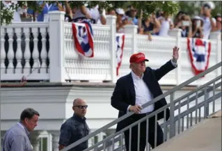  ?? JULIE JACOBSON, THE ASSOCIATED PRESS ?? Like Donald Trump seen here at the Trump National Golf Club, the president’s disapprova­l rating among Americans is climbing — to 58 per cent, according to the latest Washington Post-ABC News opinion poll.