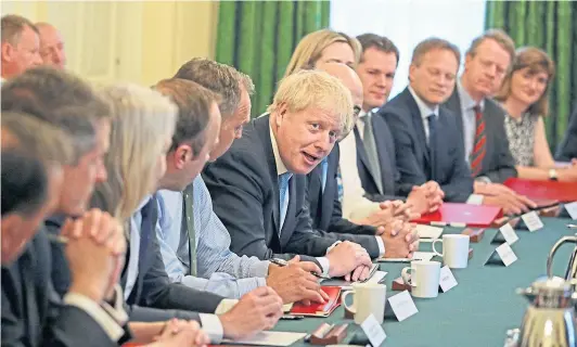  ??  ?? Britain’s new prime minister, Boris Johnson, and his “magnificen­t” cabinet. God actually help us