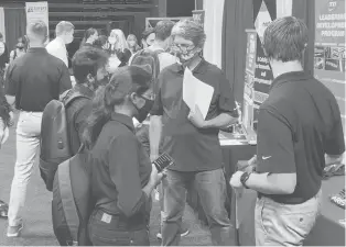  ?? SEAMUS MCAVOY/HARTFORD COURANT ?? Uconn on Tuesday hosted its first in-person career fair event since before the pandemic began, and students and employers were glad to be back.