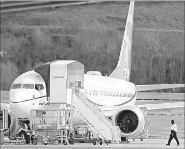  ?? Ted S. Warren ?? A 737 MAX is parked at Boeing Field in Seattle last week. Much of the legal liability depends on the findings of investigat­ions into the crashes, as well as the contracts Boeing has with airlines that purchased the planes.