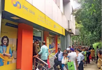  ??  ?? DÉJÀ VU Depositors line up outside a PMC Bank branch in Mumbai, hoping to secure their savings