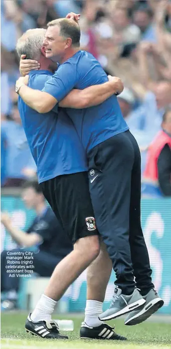 ??  ?? Coventry City manager Mark Robins (right) celebrates with assistant boss Adi Viveash