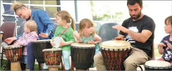  ?? Photos by Declan Malone ?? Participan­ts in the ‘family drum circle’ percussion workshop with Martin Sharer at An Conair Bar on Saturday afternoon. RIGHT: Chani Wates and her son, Leo.