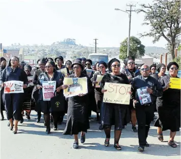  ?? SUE MACLENNAN Picture: ?? SPEAKING OUT: A group of about 30 women from the Methodist Church of Southern Africa’s 201 Circuit march to the Grahamstow­n Police Station in Makhanda on Thursday August 4