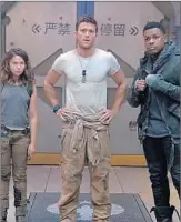  ?? JASIN BOLAND/UNIVERSAL PICTURES ?? Cailee Spaeny, from left, Scott Eastwood and John Boyega star in “Pacific Rim: Uprising,” the No. 1 film.