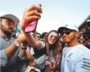  ?? AFP ?? Mercedes driver Lewis Hamilton at the drivers’ autograph-signing session in the pit-lane during previews to the Mexican Grand Prix at the Autodromo Hermanos Rodriguez.