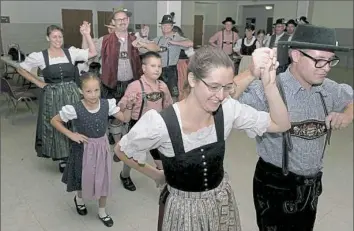  ?? Pam Panchak/Post-Gazette ?? The D'Lustigen Isartaler German dance group rehearses for its performanc­e at the first Pittsburgh Octoberfes­t to be held at the Big Butler Fairground­s.