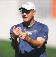  ?? David Zalubowski / Associated Press ?? Broncos defensive coordinato­r Ed Donatell directs players during training camp on Aug. 6. Donatell, who’s 63, said the virtual offseason led to a burst of creativity among coaches, the discovery of new teaching tools and a better connection with players one-third his age.