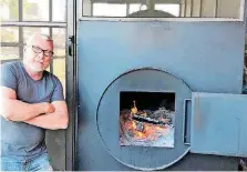  ?? [PHOTO BY DAVE CATHEY, THE OKLAHOMAN] ?? Designer and contractor Larry Dean Pickering, who built this commercial smoker for Maples Barbecue, will now go to work on a restaurant of his own called Canvas.