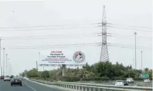  ?? — AFP ?? A billboard welcoming guests participat­ing in the Kuwait Internatio­nal Conference for Reconstruc­tion of Iraq, along a highway in Kuwait City.