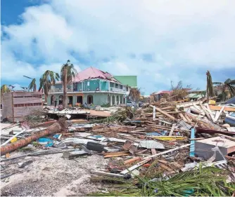  ?? LIONEL CHAMOISEAU, AFP/GETTY IMAGES ?? Hurricane Irma flung rubble around Orient Bay on the Caribbean island of Saint Martin.