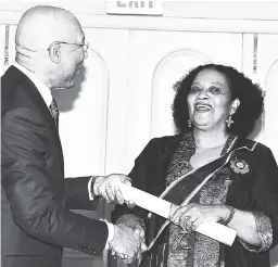  ?? CONTRIBUTE­D ?? Lorna Goodison being invested as Poet Laureate of Jamaica 2017-2020 by Governor General Sir Patrick Allen at a ceremony at King’s House, recently.