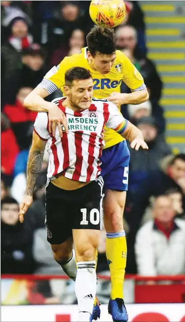  ??  ?? HEAD MASTER: Leeds’ Aapo Halme gets up above Blades skipper Billy Sharp