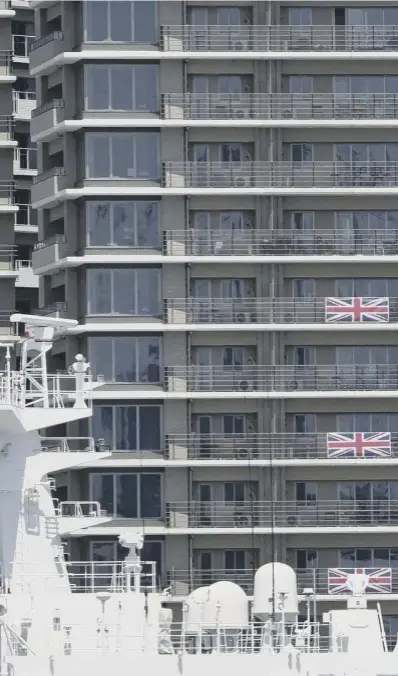  ??  ?? 0 Flags and banners hang from the Great Britain team apartments in the Olympic athletes’ village